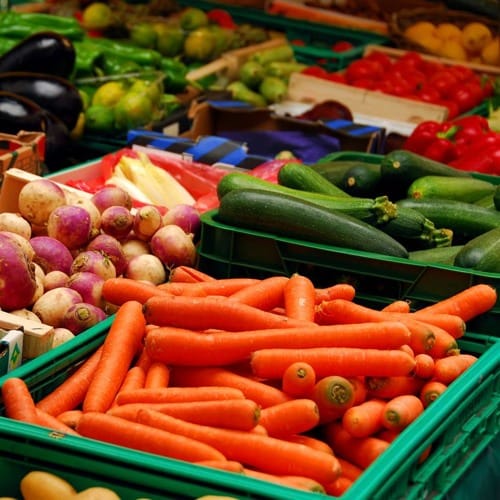 Fresh organic fruits and vegetables displayed at a California farmers market