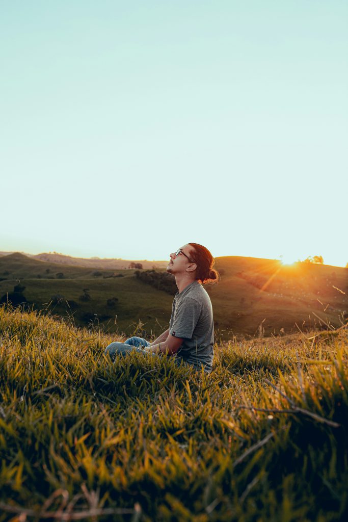 "Person practicing meditation for stress management and overall wellness"
